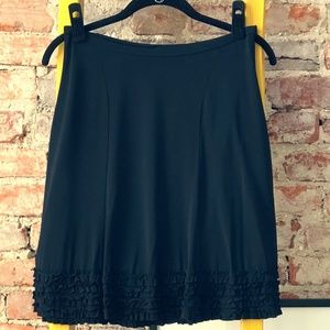 Sisley black skirt with cuff ruffle.